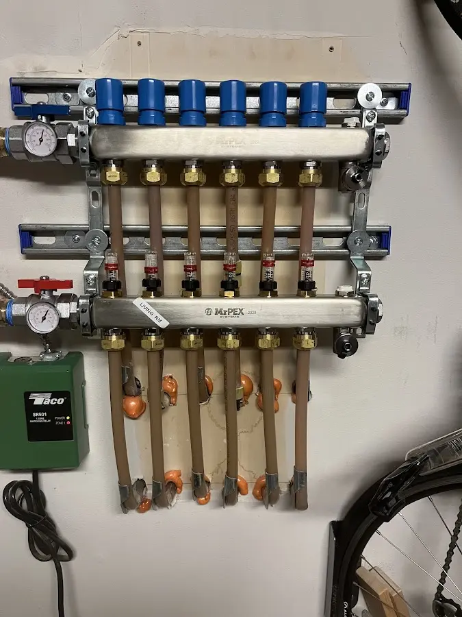 Plumber performing Water Heater Repair at a residential property in Carteret